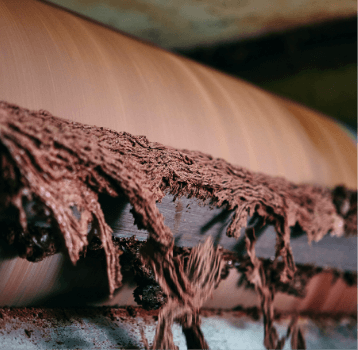 Refining is a sophisticated technique necessary to reduce the particle size of the chocolate. The mixed mass is passed through refiners to bring the final product to 12 micronsin order to obtain a smooth chocolateeasy to melt under our palate.